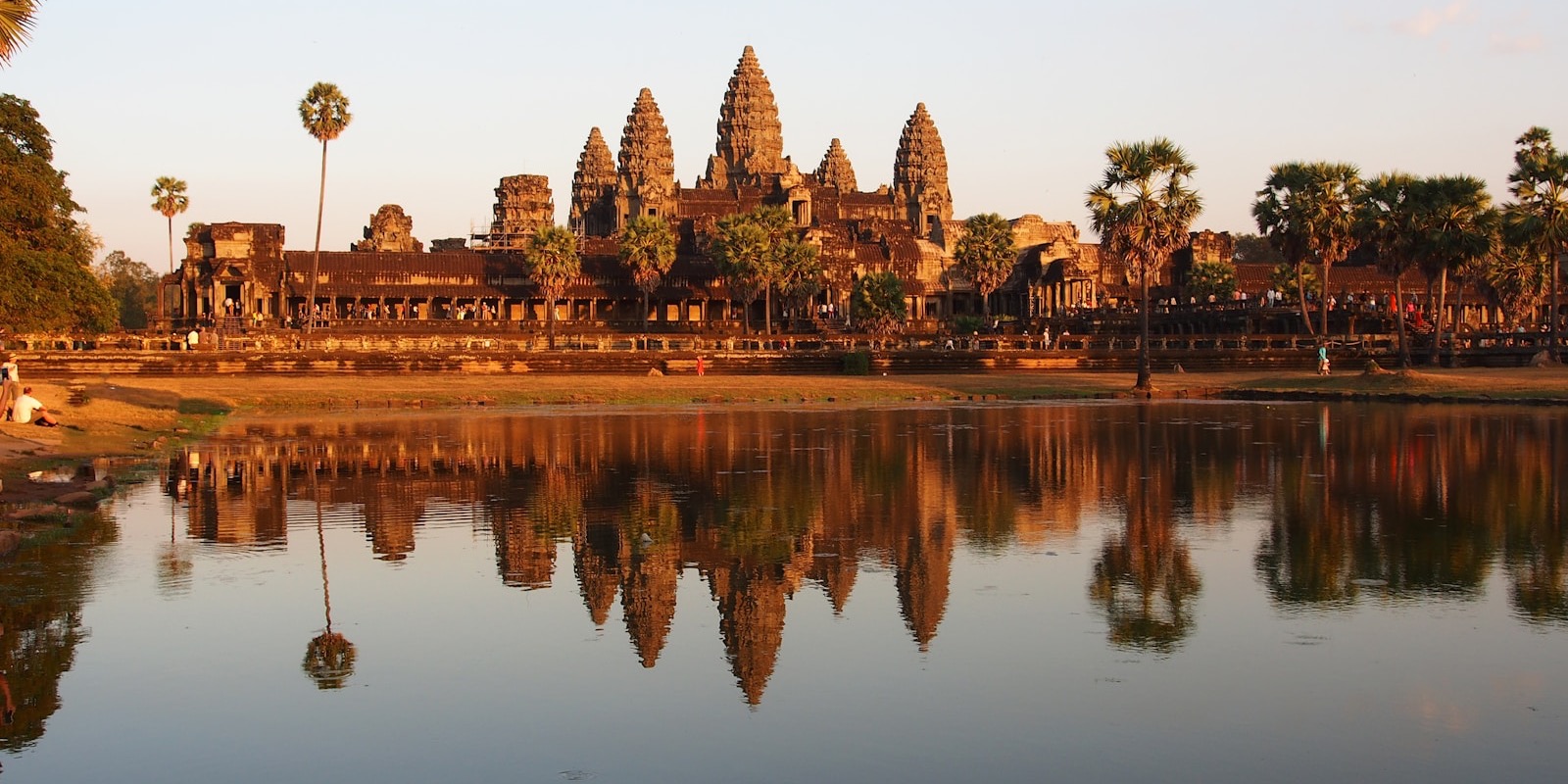 The temple towers of Angkor Wat reflected in water, Cambodia